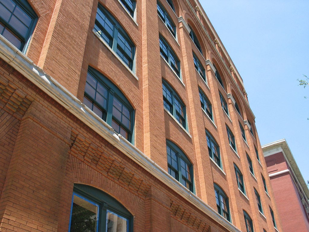 This is an image of the outside of the building that features The Sixth Floor Museum. 